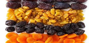 Traditional Armenian dried fruits including apricots, raisins, and dates arranged in rows