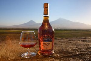 ARARAT Akhtamar Armenian brandy bottle and glass with Mount Ararat in the background